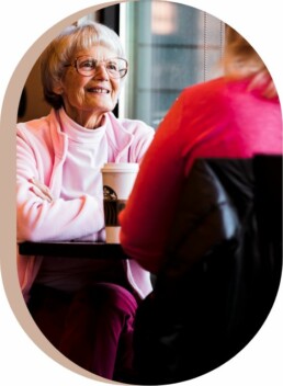 Woman enjoying coffee with carer in Tamworth